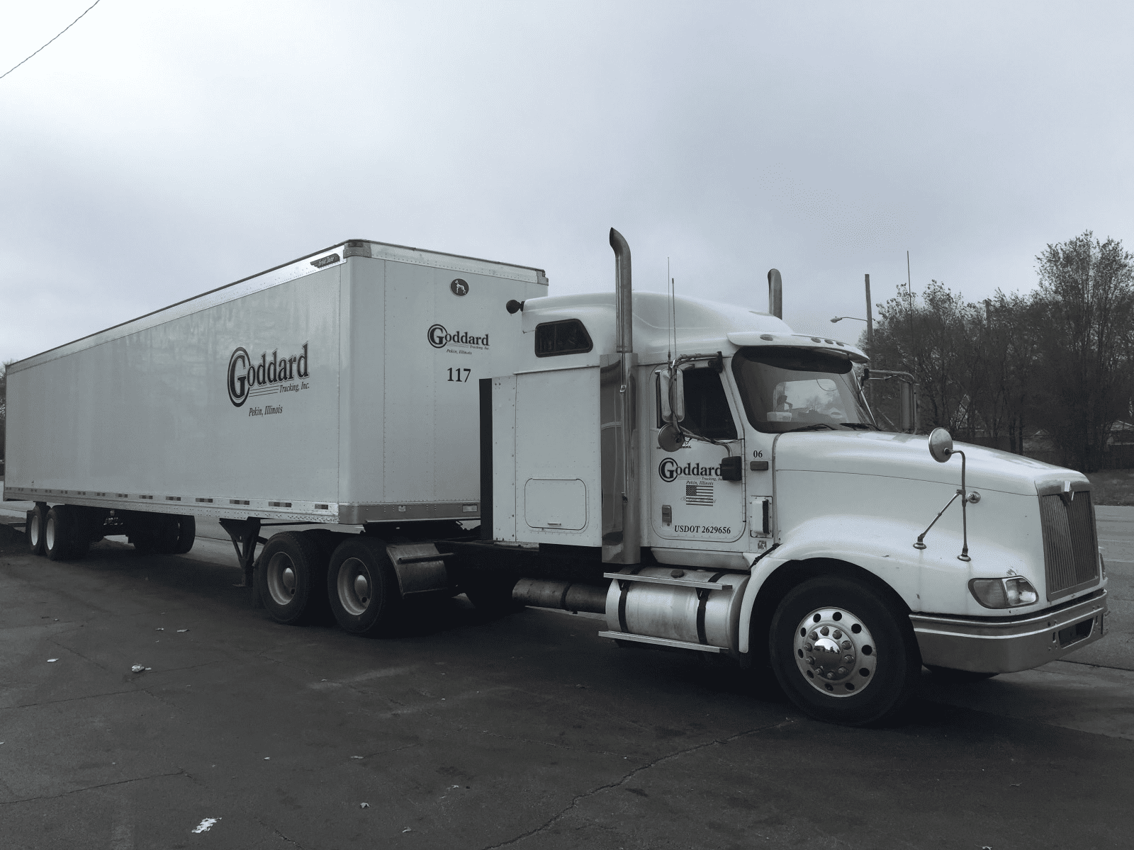 Goddard white truck on the street